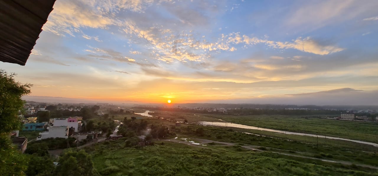 Panoramic sunset view over Asan River from Buransadhar Apartments